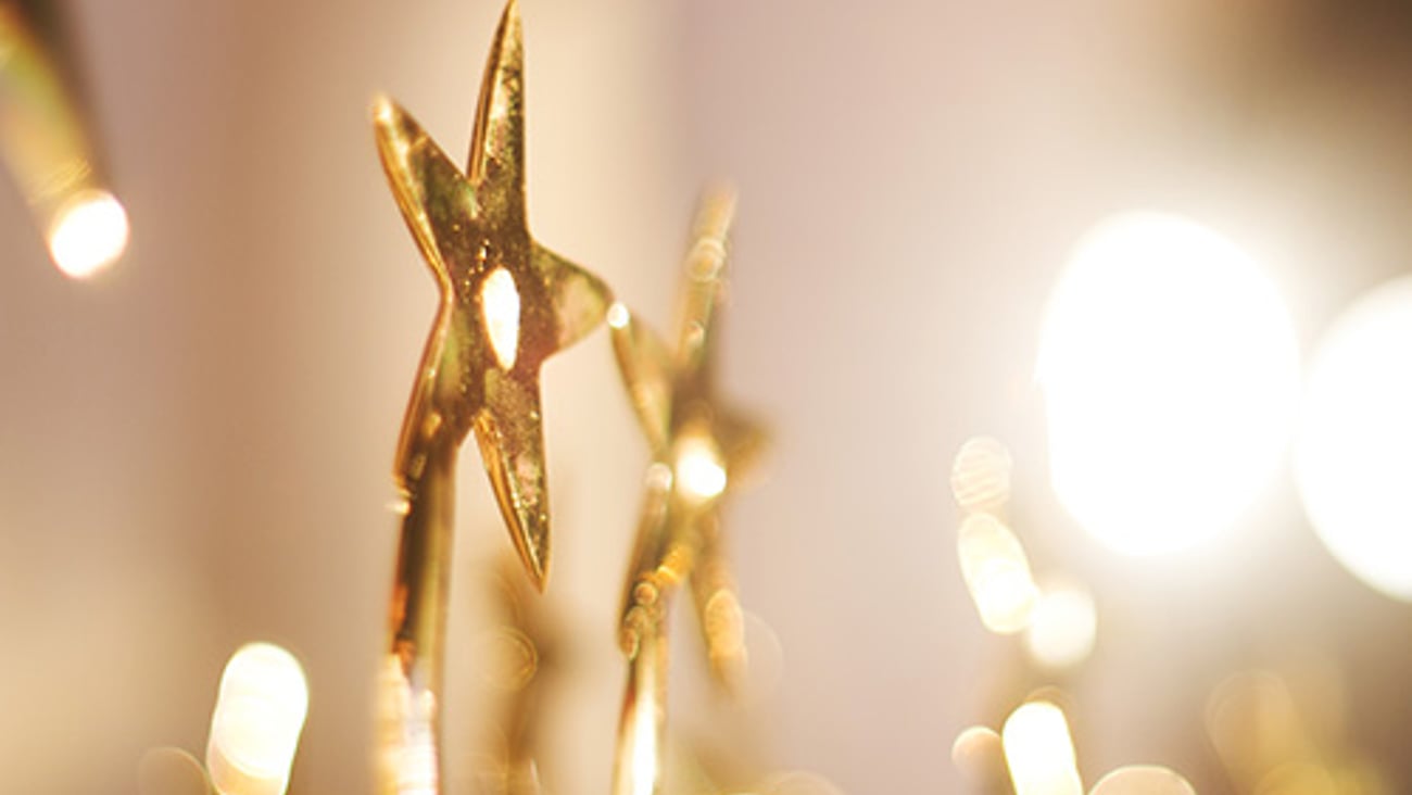 Gold trophies with stars.
