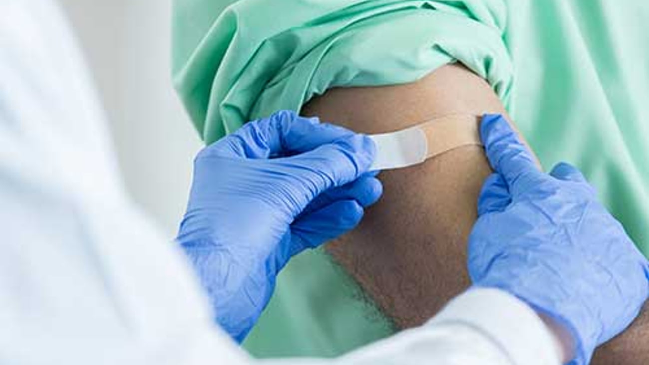 A healthcare worker giving an immunization. 