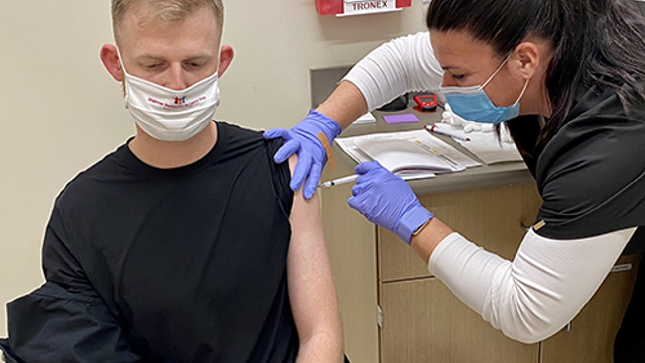 Hy-Vee pharmacist giving a vaccine