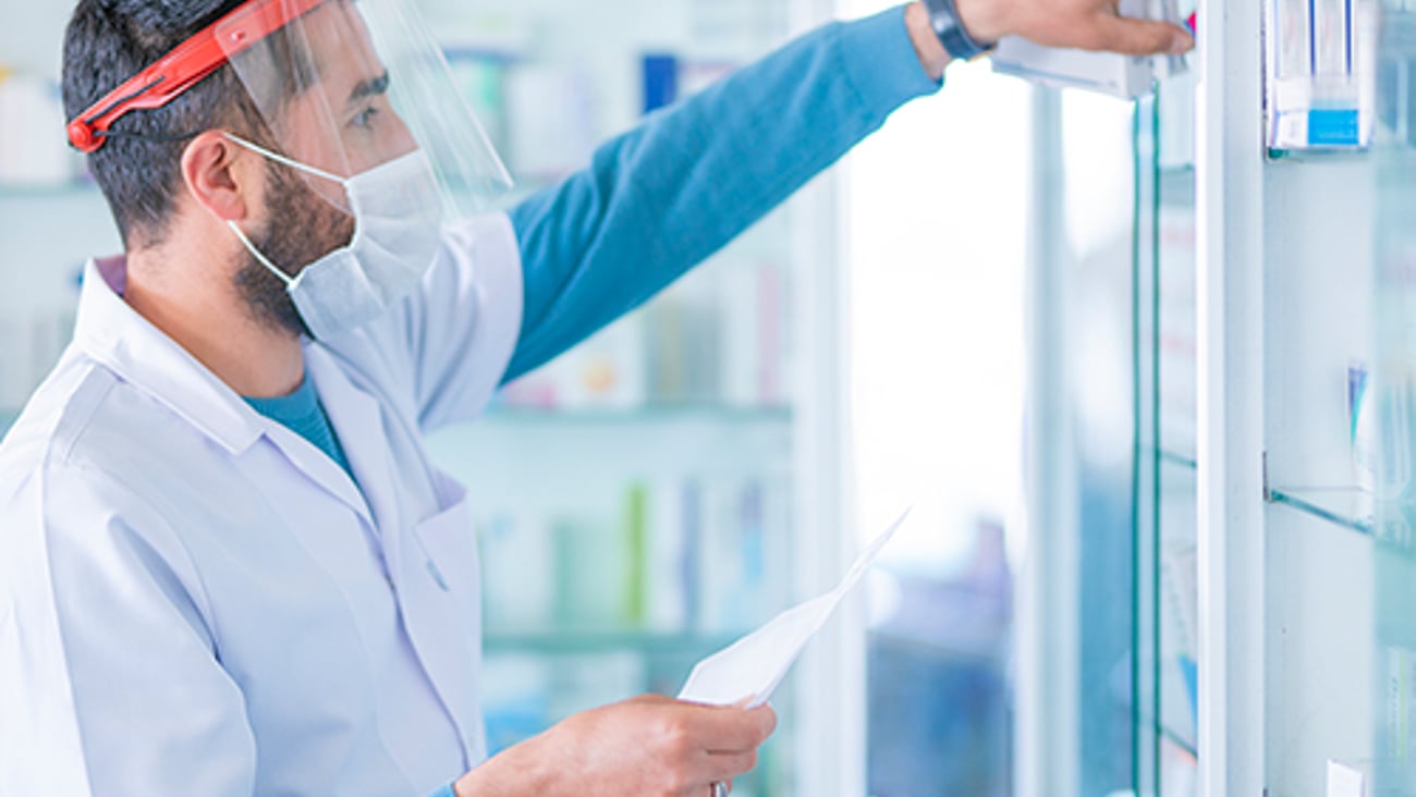 A pharmacist in a stock room.