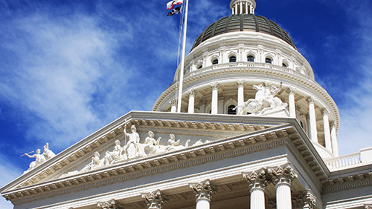 a statue in front of California State Capitol