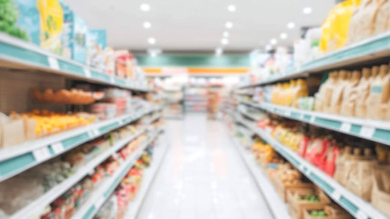 Grocery store interior defocused backdrop, wide merchandise range, vibrant supermarket aisle, shopping environment, assortment of goods on shelves, blurred background depicting retail shopping; Shutterstock ID 2467551709