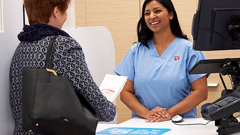 Walgreens pharmacist with patient