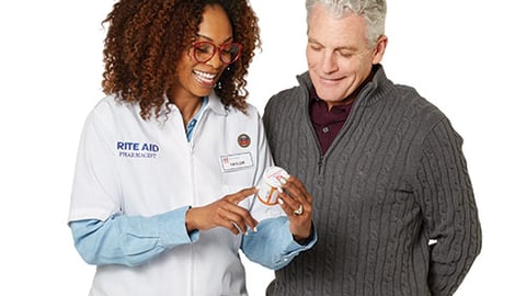 Rite Aid pharmacist with patient