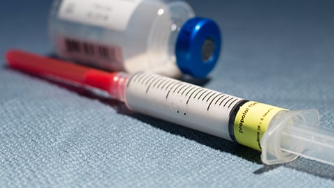 A syringe with a vial.