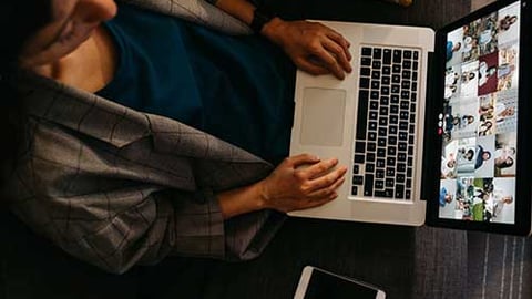 Person at a virtual event on computer.