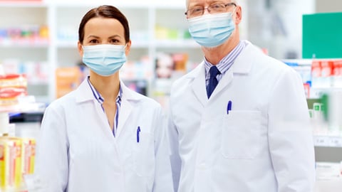 a man and a woman standing in front of a store