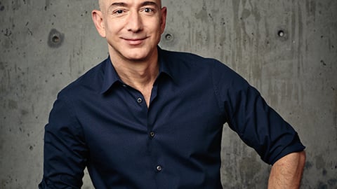 Jeff Bezos standing in front of a building