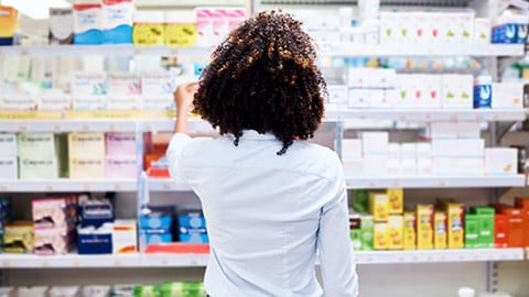 a person standing in front of a store