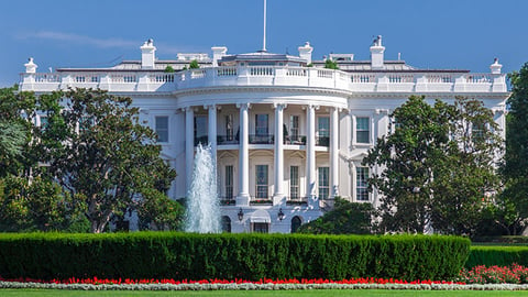 a large building with White House in the background