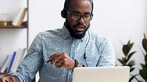 A person at a computer. 