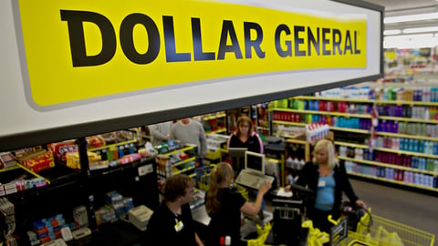 a group of people standing in front of a store