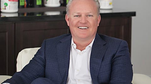 a person sitting at a table posing for the camera