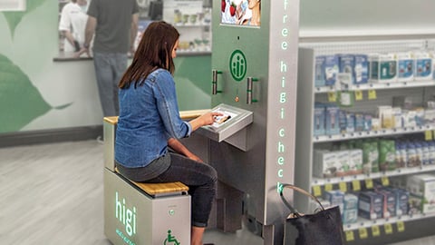 a person sitting in front of a store