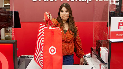 a woman standing in front of a store