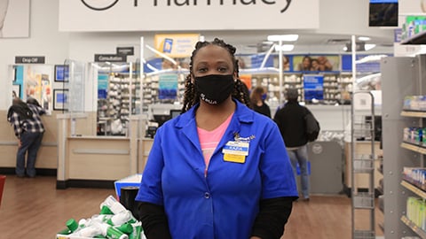 a person standing in front of a shop