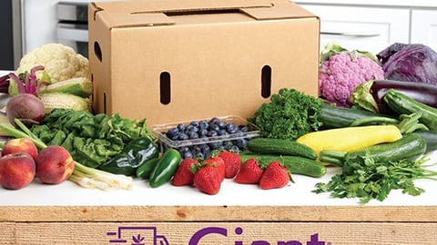 a box filled with different types of vegetables