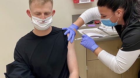 Hy-Vee pharmacist giving a vaccine