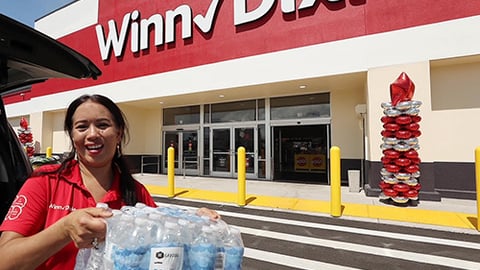 a person standing in front of a store