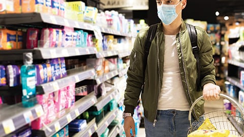 a person standing in front of a store