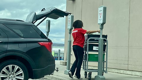 a person standing in front of a car