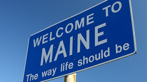 a close up of a street sign on a pole