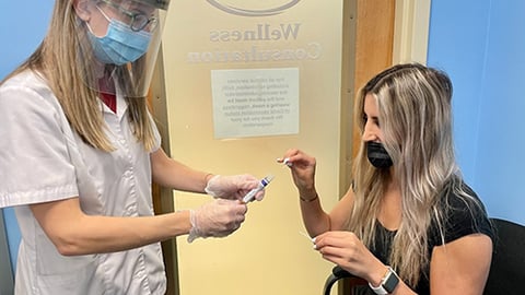 a woman holding a cell phone