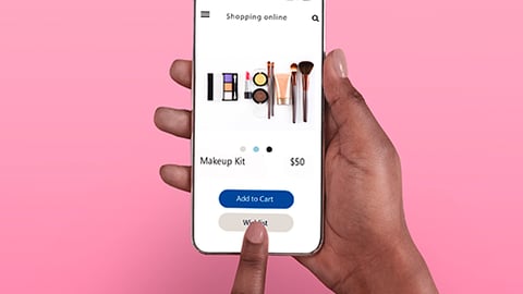 a hand holding a cell phone