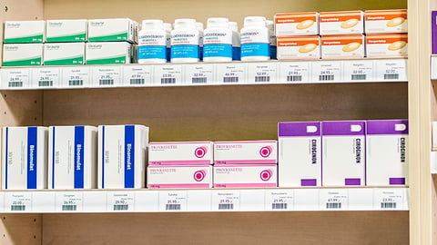 A pharmacy shelf with medications.