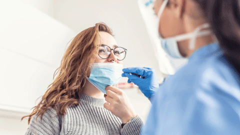 woman getting flu test