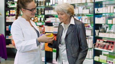 Young pharmacist giving advices about medication to senior female patient in a pharmacy; Shutterstock ID 158254262