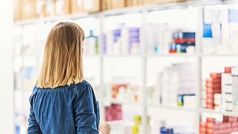 woman shopping in pharmacy teaser size