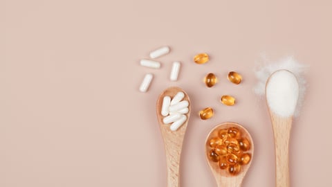 Supplements for health , vitamin D zinc and vitamin C powder in wooden spoons on beige background. copy space top view .healthy lifestyle concept. ; Shutterstock ID 1877777167