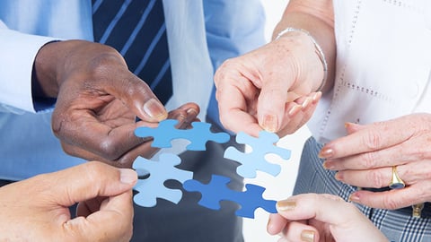 a close up of a person cutting a piece of paper