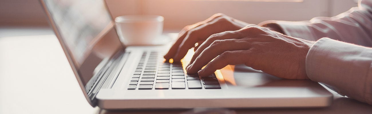 person typing on keyboard