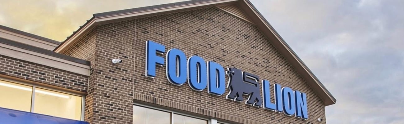 a sign in front of a brick building