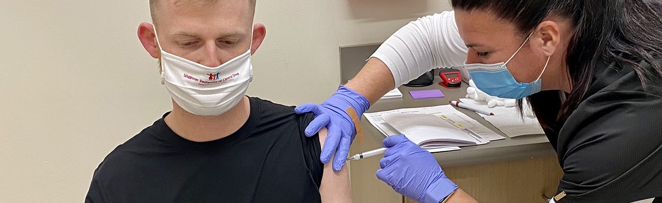 Hy-Vee pharmacist giving a vaccine