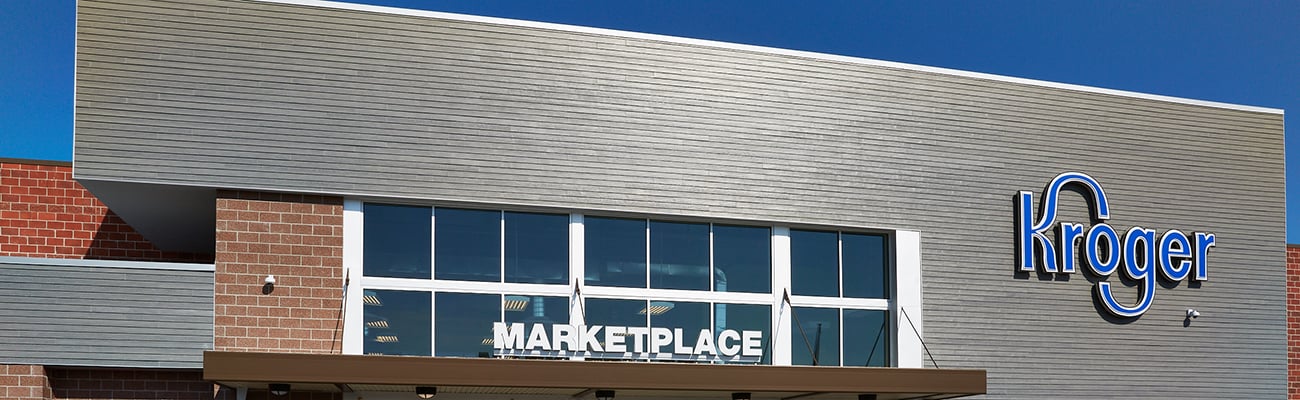 a sign in front of a brick building