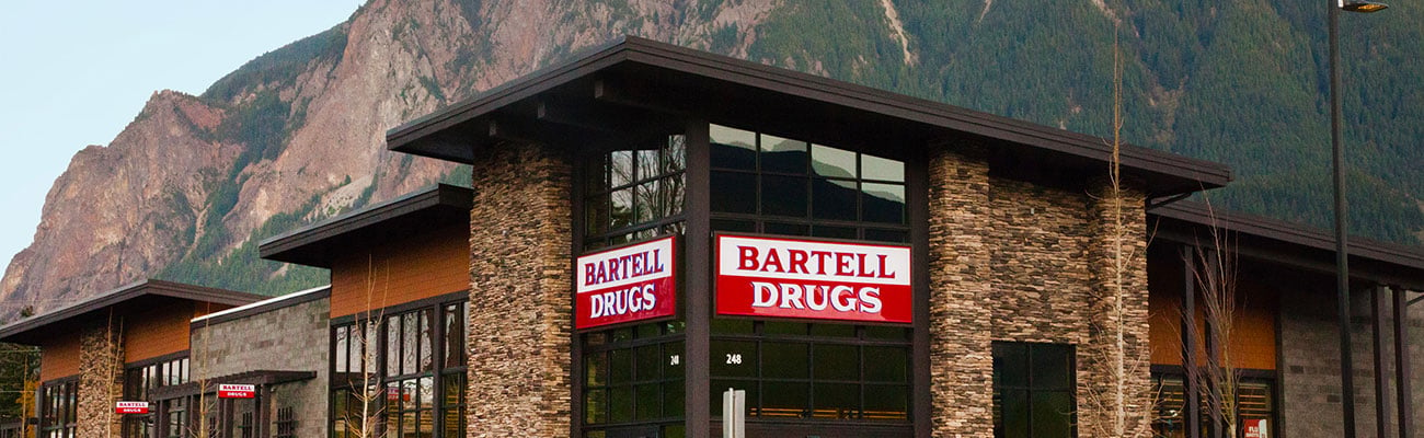 a sign above a storefront on a brick building