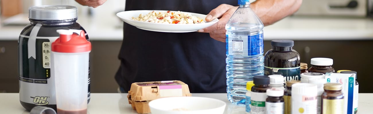 a person sitting at a table with a plate of food