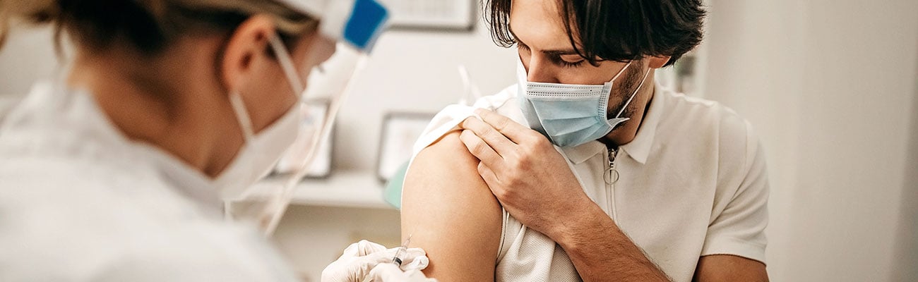 An adolescent getting a vaccine