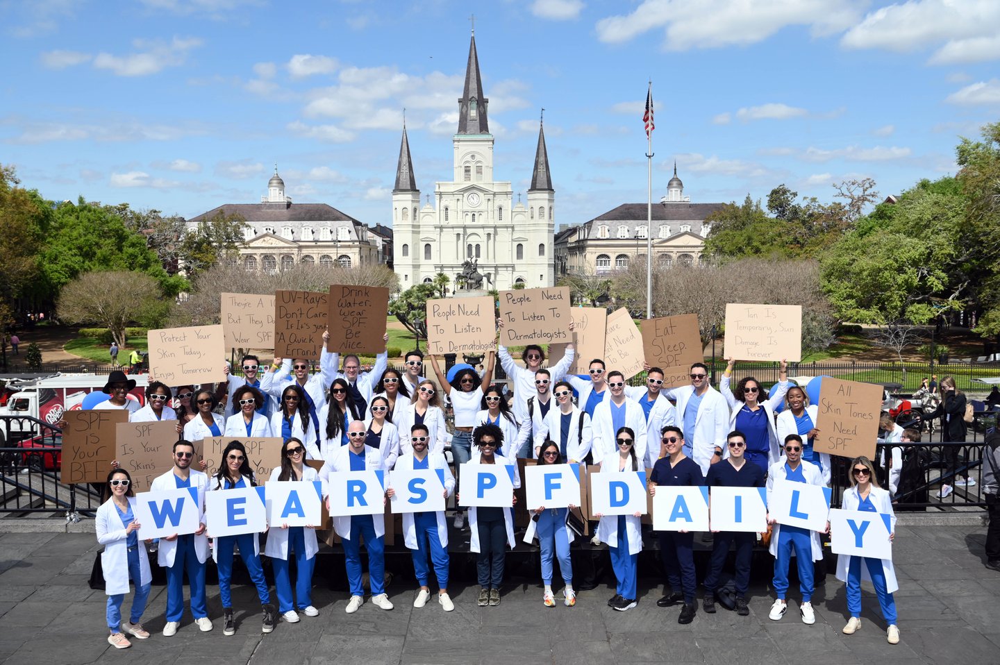 International dermatologists, Dude With Sign, and Dudette With Sign 