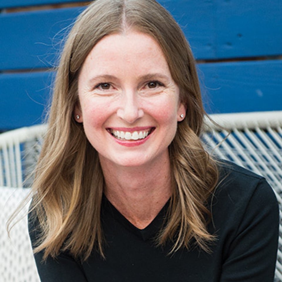 a woman smiling for the camera