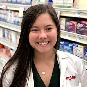 a woman standing in front of a store