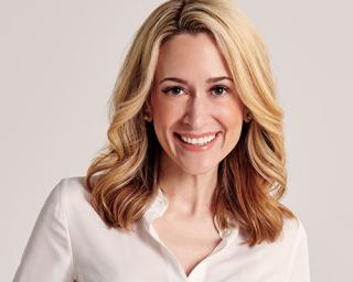 a woman smiling for the camera