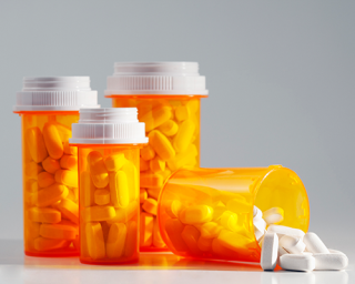 Pill bottles with white pills