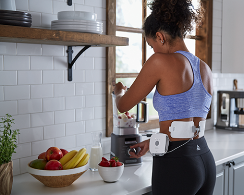 a person sitting on a kitchen counter