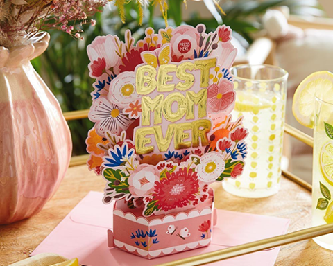 a vase filled with flowers sitting on a table