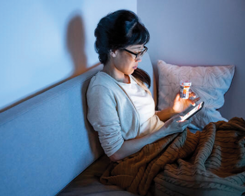 a woman sitting on a bed