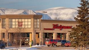 a building with a store on the side of a road